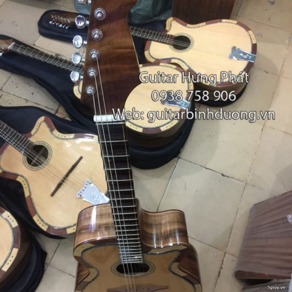 Bán đàn guitar cổ phím lõm giá siêu rẻ tại bình dương